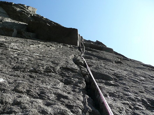 Looking towards Fi's belay on sunny pocketed slab of Integrity  © Ron Walker