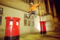 Danny Brown jumping between red postboxes in Sheffield City Centre