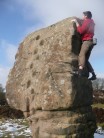Mike bouldering on the Cork Stone, Stanton Moor.