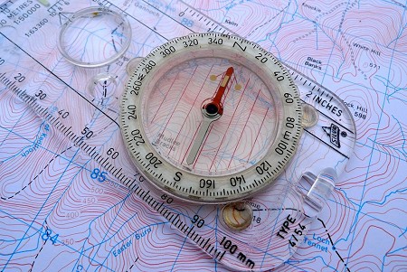 Turn yourself and the map without touching the compass till the red needle lines up with the arrow  © Ian Hey