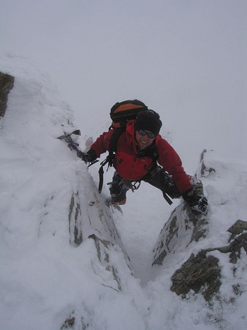 Adam Wainwright tackling the crux of Piz Buin in full Scottish conditions.   © Andy Perkins