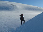 Utter Desolation below Ben MacDui and above Loch Etchachan. Iain taking it all in before digging a home for the night.