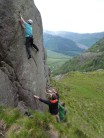 A small army of spotters always helps with the head game.  Climber: Mark Roe
