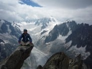 Rob Taylor contemplating life on the south ridge of the Aiguille du Moine.