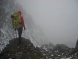 Looking out across an outcrop on a foggy great gable ascent