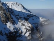 Upper reaches of Ledge Route above the clouds in inversion conditions (as seen from Tower Ridge).