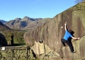 Reaching for "The Pocket" - Langdale Boulders
