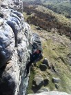 Ben Davison soloing Klondyke Wall on a clear February day - Blowing chalk from his fingers! No posing required.