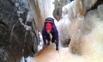 Andrew making his way up The Big Wall Gully with the icicle backdrop