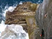 John McCune on a rare ascent of Kerry Gold E4 5c, Valentia Island, Co. Kerry, Ireland.