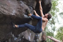 Making the crux move on Fingers at Wrights rock