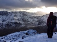 Standing on the summit of Pen Yr Ole Wen looking over Cwm Idwal and Snowdon