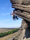 Making the essential heel hooks on Flying Buttress Direct at Stanage Popular