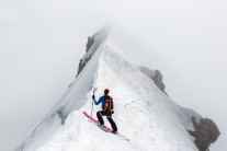 Joel Evans takes a moment before committing to the crux section on a ski descent of Mont Blanc's Brenva Spur