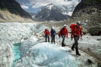 Team of scientists walking along the ice at Mer De Glace