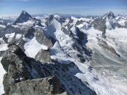Zinalrothorn. SE Ridge, Matterhorn and Dent Blanche