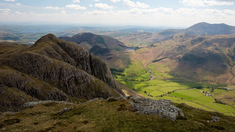 The mighty Gimmer Crag looms over the fields of Langdale  © Alex Roddie