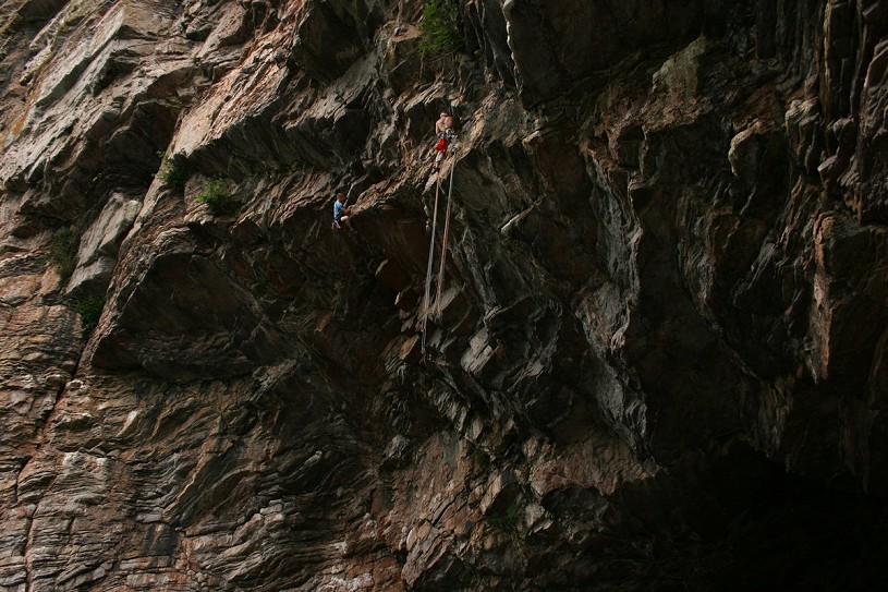 Harry Nine-Toes and Tim Emmett on Caveman. The second pitch of <em>The Curse</em> emerges from the roof to belay where Harry is. On a DWS ascent of Caveman the section of climbing between Tim and Harry is redundant. Photo: Grant Farquhar.  © Grant Farquhar
