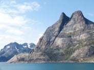 South Greenland, In Prince Christian Sound, the village of Aappilattoq just visible beneath an unknown mountain.