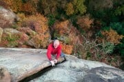 Cratcliffe displaying it's autumn colours. Simon Nadin approaching the top of the classic suicide wall.