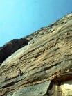 Tony Howard on the first pitch of the first ascent of Towering Inferno. Jebel Rum, Wadi Rum. 300m ED inf. October 1986.