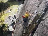 Sasha reaching for a crimp on her first E1 lead, Looning The Tube. Sam L on the belay and Will D on the camera.