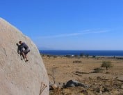 Gordie Lees bouldering on a very windy day in Kos