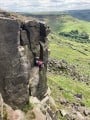 Emma Harrington climbing Atropine at Castle Naze