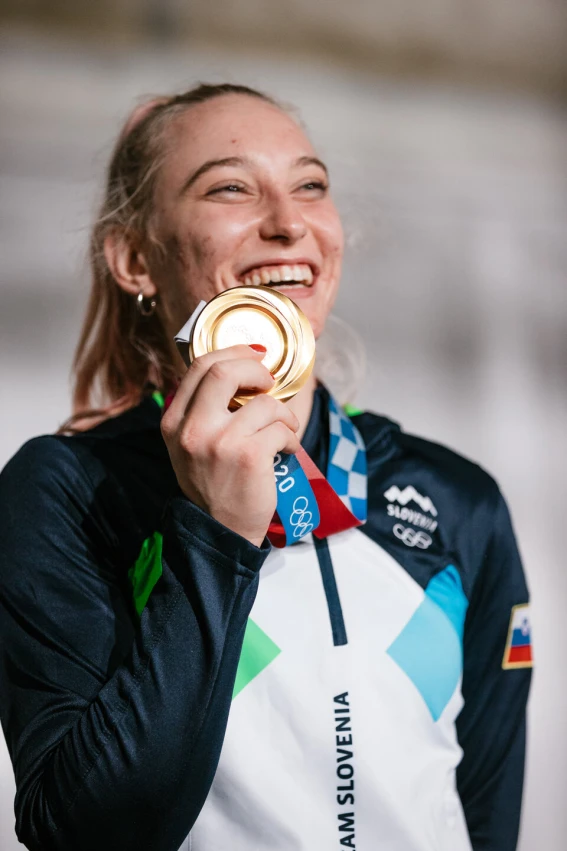 Janja Garnbret with her gold medal.  © Jon Glassberg / Louder Than 11