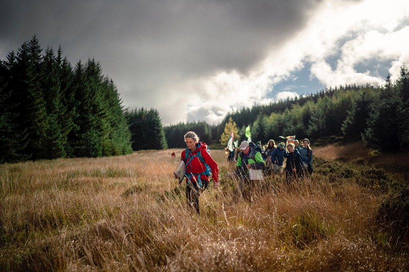 Helen Locke leads the Camino through the woods between Moffat and Abington  © Camino to COP26