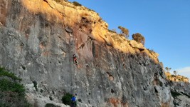 Australian climber on Ses Tres Maries 6a+ at Cala Magraner