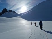 Team roped up on glacier before summiting Charlotte Peak.