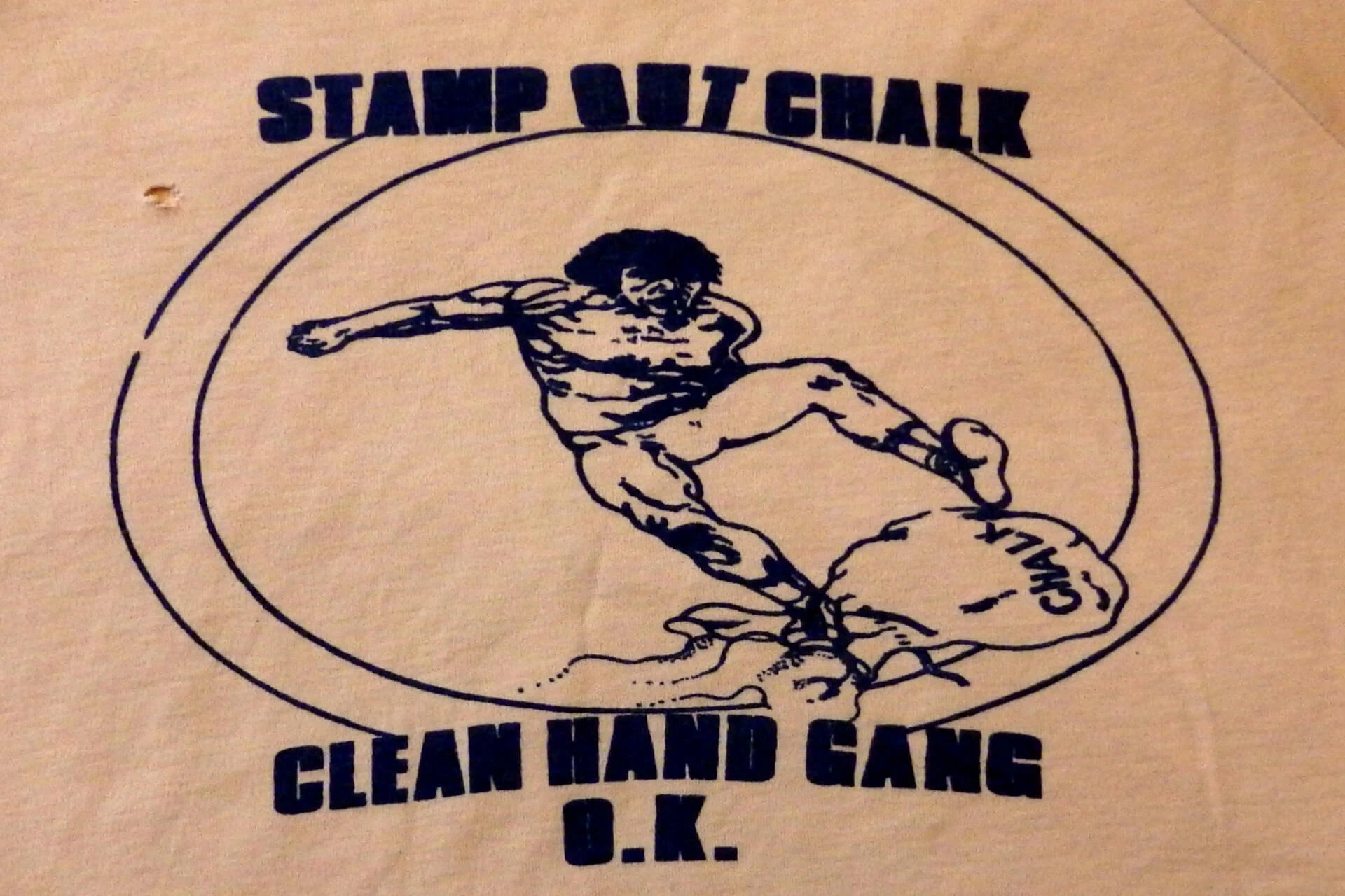 A T-shirt design showing Arnis Strapcans stamping out chalk.