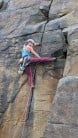 Amy climbing out of the finger crack on Joanna, VS 5a