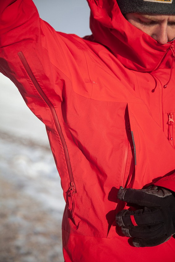 Well sized pit zips for ventilation and raised hand warmer pockets allow for use with a harness  © UKC Gear