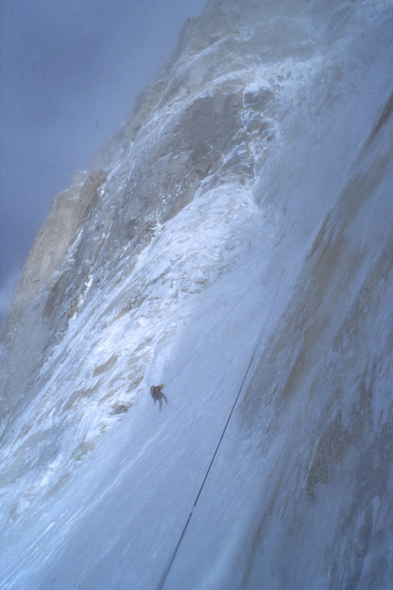 Andy on the descent retrieving a dropped ice tool.  © Athol Whimp