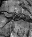 John Syrett making the third ascent of Wall of Horrors (E3 6a), Almscliff, in a howling gale in November 1970.