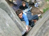 Penny Allchin battles with the polish on Castle Crack (HS 4b) at Stanage