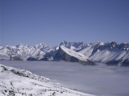 Above the inversion, falaise de Les Gicons in the middle foreground, the Ecrins in the background