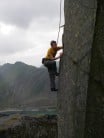 Sion Idwal Long seconding XXXposure (6a+)in the Llanberis slate quarries